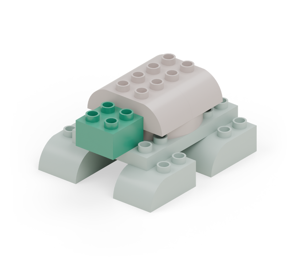 Add the green square at the front for the neck. Its back row rests on the exposed green body row; its front row projects forward. New additions are shown in their original colours; earlier pieces are lighter.