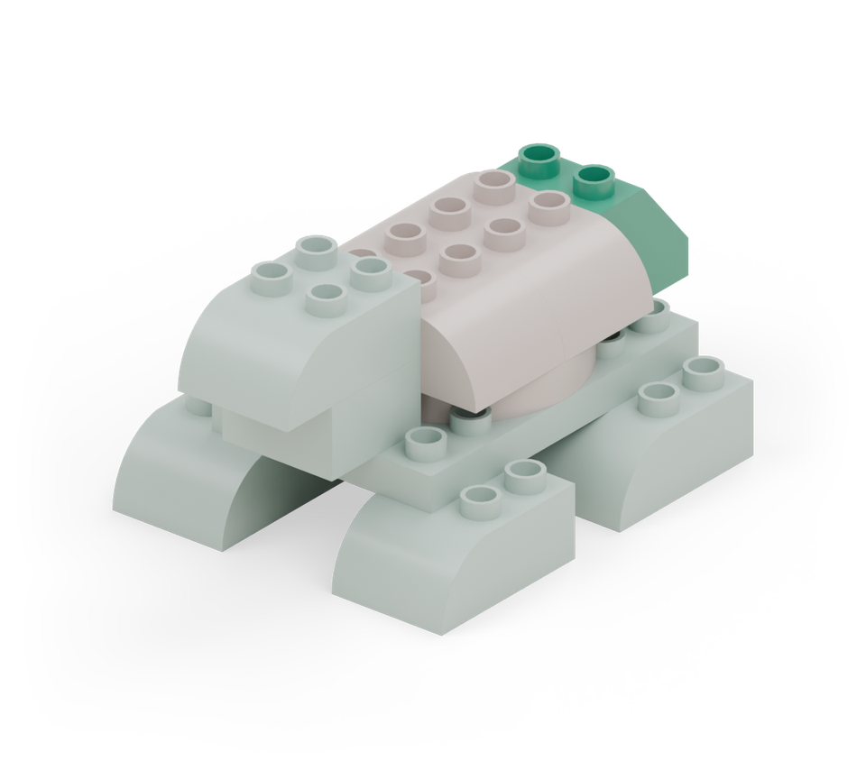 Finish with the small green slope at the back. Its high row attaches to the body and its low end points backward as the tail. New additions are shown in their original colours; earlier pieces are lighter.