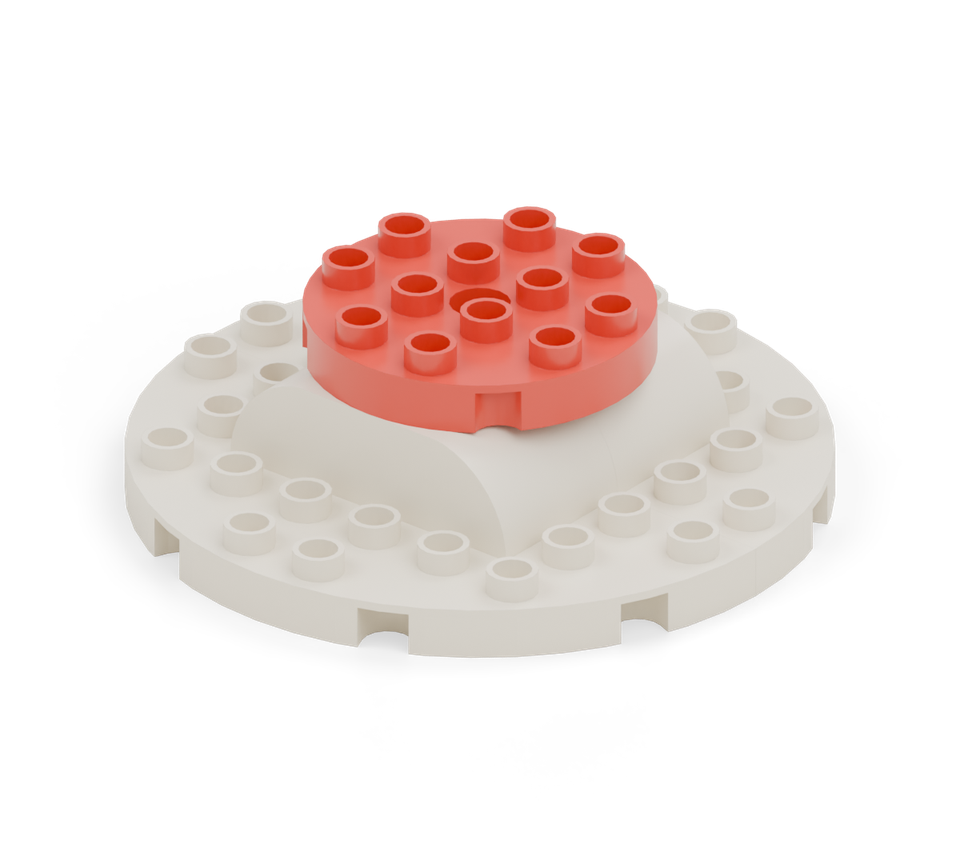 Join the two sponge halves with the red round plate as a strawberry filling layer.
