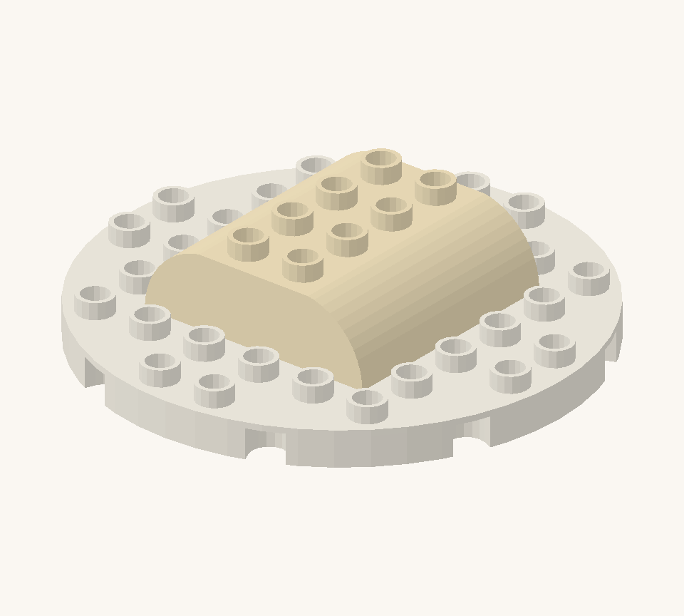 Centre two cream double-curved bricks on the platter as the lower sponge layer. Turn both across the platter, one on each side of its middle seam. New additions are shown in their original colours; earlier pieces are lighter.