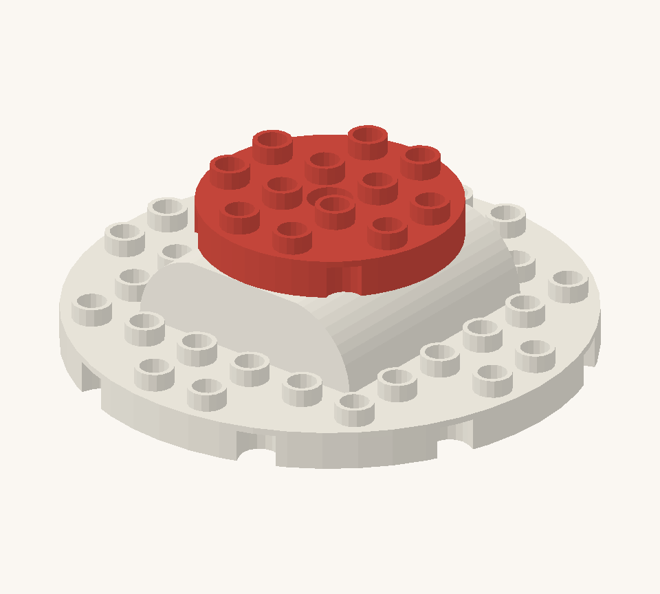 Join the two sponge halves with the red round plate as a strawberry filling layer. New additions are shown in their original colours; earlier pieces are lighter.