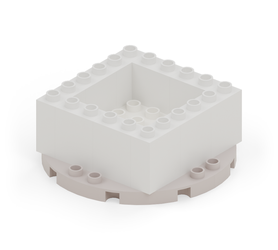 Put a white 4 × 4 plate in the opening. It is the hatchling’s broad foot and lifts out with the whole dragon. New additions are shown in their original colours; earlier pieces are lighter.