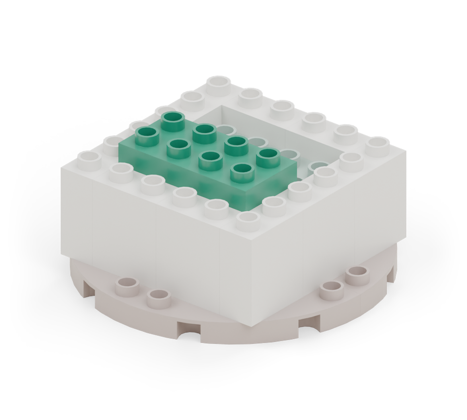 Put another green 2 × 4 brick across the front half. This makes the broad snout. New additions are shown in their original colours; earlier pieces are lighter.
