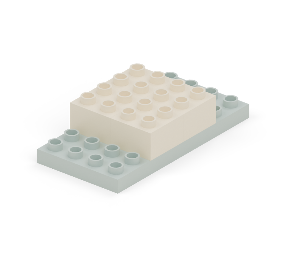 Make a four-by-four square of cream bricks in the centre of the base. Leave two rows of base showing at either end.