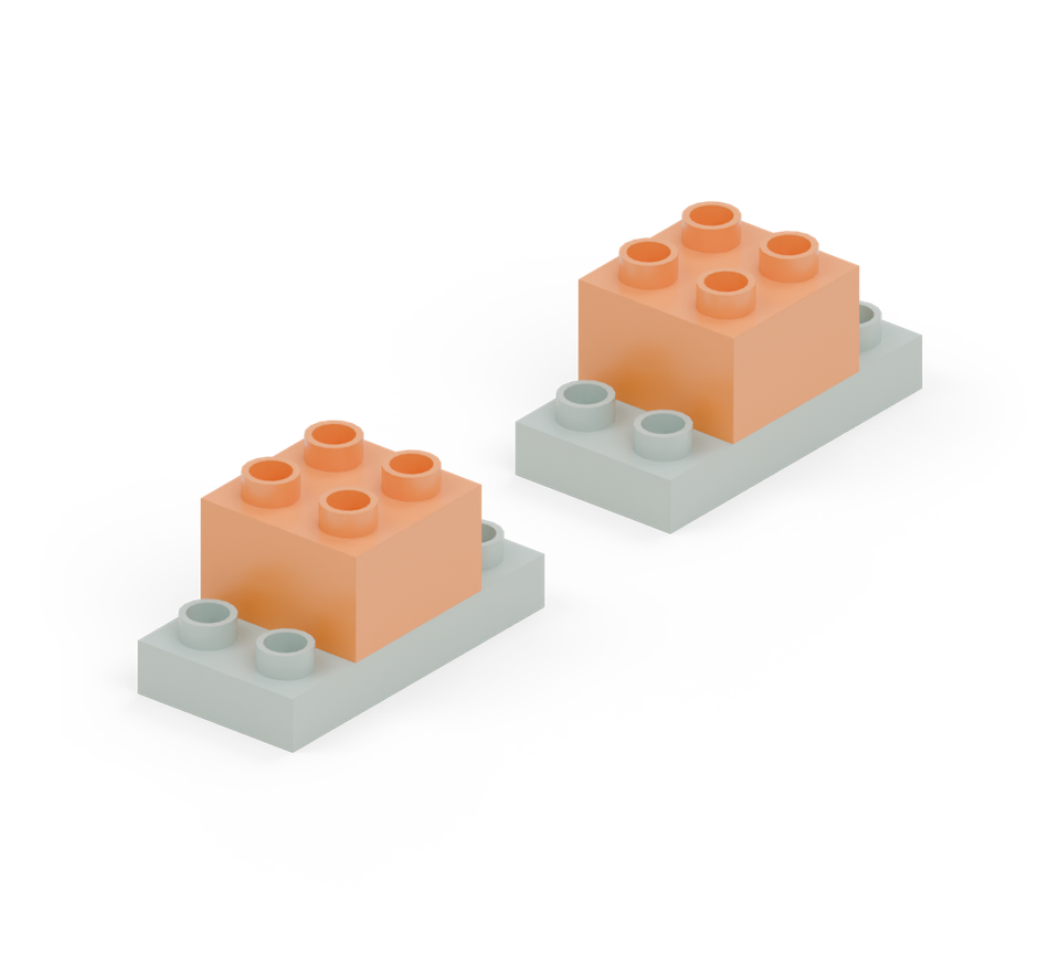 Centre an orange square brick on each green plate. One row of each plate remains showing at either end.