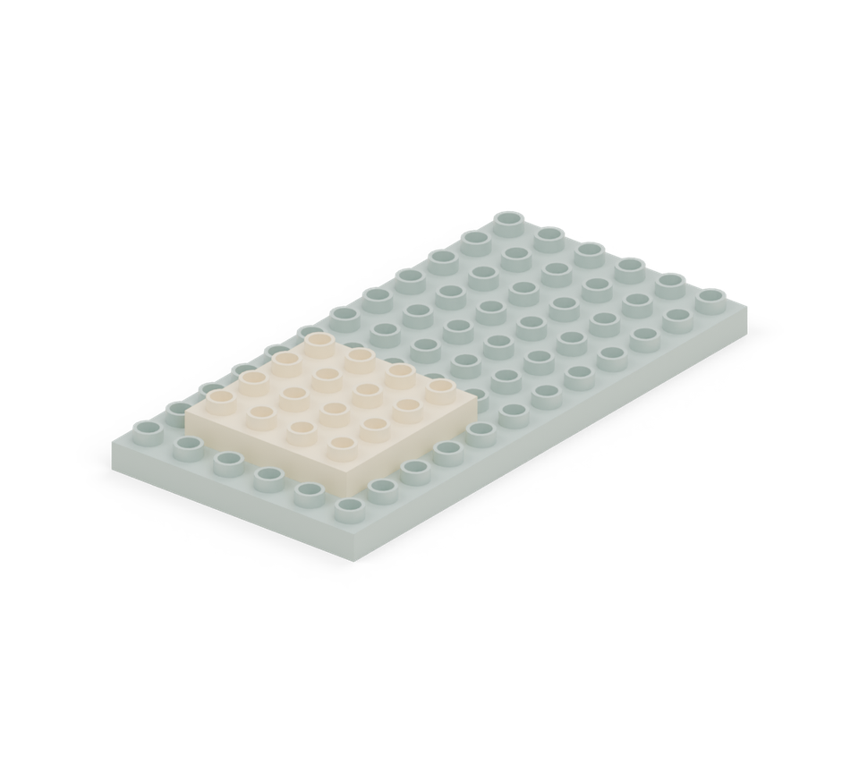 Lay the cream square plate near the front for the porch. Leave one row of green studs along each side and in front of it; the cottage will sit behind it.