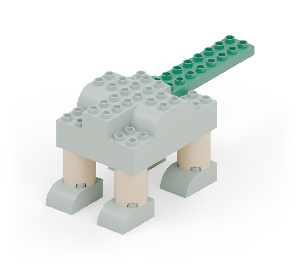 Add the green long plate behind the centre brick to make the tail. Its front two rows attach to the body; the rest projects backward. New additions are shown in their original colours; earlier pieces are lighter.