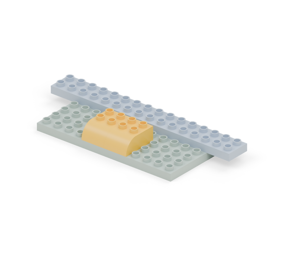 Step 3: Place two yellow curved bricks in front of the fan, side by side, with their round ends forwards.