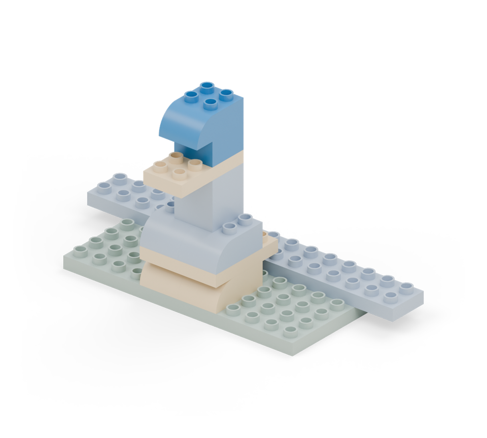 Step 7: Put a blue square on the back half of the yellow plate. Finish with a blue curved brick, its round end forwards.