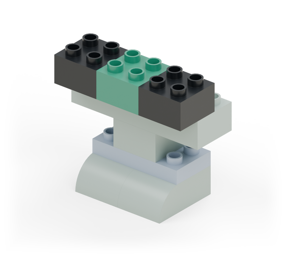 Step 5: Put a black square at each end of the jaw and a green square between them. Their back rows sit on the front row of the jaw; the front rows project towards you.