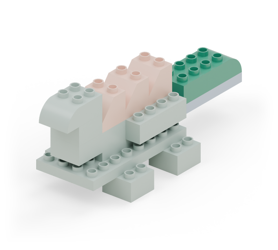 Step 8: Put a green curved brick at the far end of the tail plate, rounded end pointing backwards. Add a green square directly in front of it.